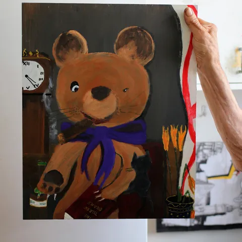 Detail: Bear with a purple scarf.