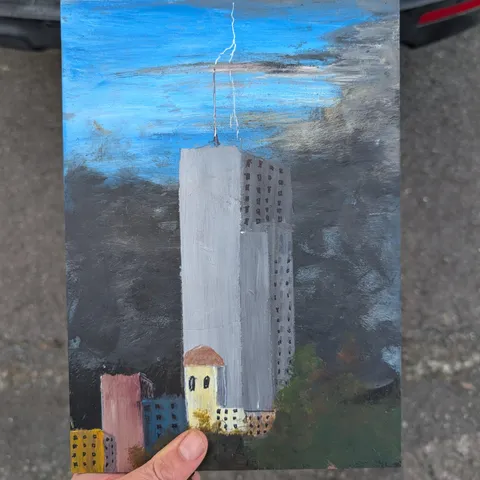Detail: Tall grey building.