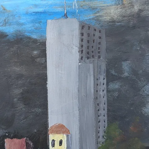 Detail: Tall grey building.