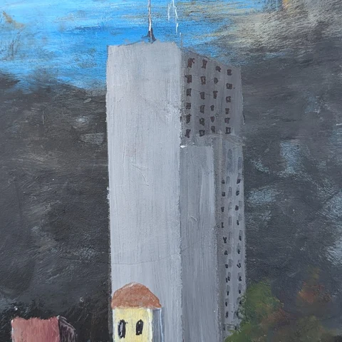 Detail: Tall grey building.